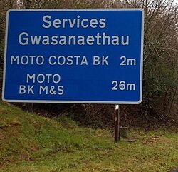 Moto Motorway services sign in Wales.