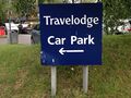Sign saying 'Travelodge car park'.