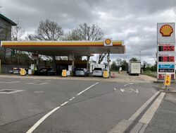 The entrance to a Shell-branded forecourt.