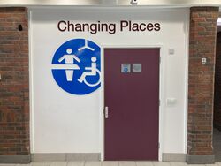 Changing Places logo on a door.