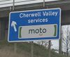 Sign saying 'Cherwell Valley services, Moto'.