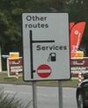 Services on a direction sign.