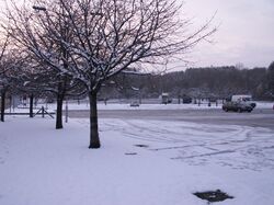 A snowy car park.