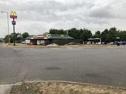 A McDonald's restaurant, viewed across a road.