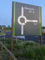 Roundabout sign on a black background.