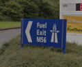 Sign saying 'fuel, exit, M56'.